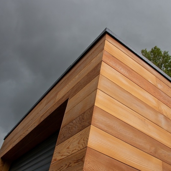 What are the benefits of cladding a building?